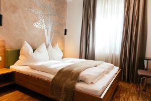 Aparthotel Heuberger客房内的一张或多张床位