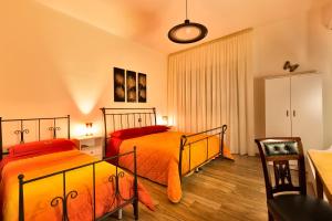 Postel nebo postele na pokoji v ubytování B&B Casa Rossella