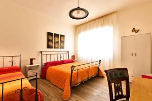 Postel nebo postele na pokoji v ubytování B&B Casa Rossella