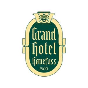 Un certificado, premio, letrero u otro documento en Grand Hotel Hønefoss