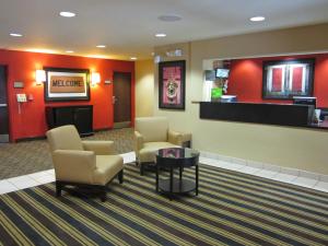 
a living room filled with furniture and a television at Extended Stay America Suites - Los Angeles - LAX Airport in Los Angeles
