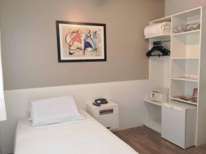 Posteľ alebo postele v izbe v ubytovaní Cosmos Hotel