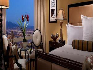 a hotel room with a bed and a window at Trump International Hotel Las Vegas in Las Vegas