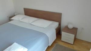 Posteľ alebo postele v izbe v ubytovaní Apartments Šuperba