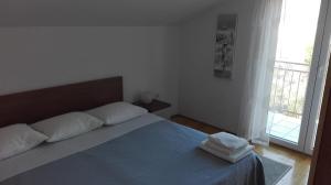 Posteľ alebo postele v izbe v ubytovaní Apartments Šuperba