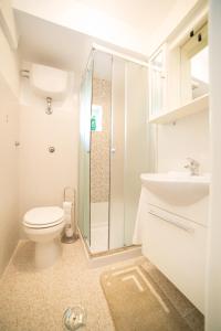 a bathroom with a shower and a toilet and a sink at La dimora di Maria in Mottola +35 photos