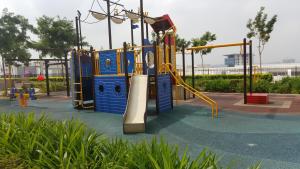 a playground in a park with a slide at Zen Studio @ Trefoil Setia Alam in Shah Alam