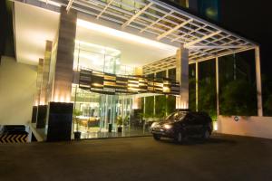 a car parked in front of a building at night at Hotel 88 Kopo Bandung By WH in Bandung