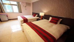 Postel nebo postele na pokoji v ubytování Liwu Hotel Taroko