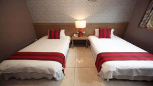 Postel nebo postele na pokoji v ubytování Liwu Hotel Taroko