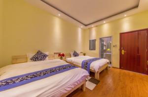 Letto o letti in una camera di Mengyuanju Boutique Inn