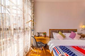 Letto o letti in una camera di Mengyuanju Boutique Inn