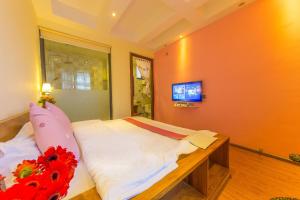 TV o dispositivi per l'intrattenimento presso Mengyuanju Boutique Inn