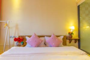 Letto o letti in una camera di Mengyuanju Boutique Inn