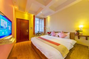 Letto o letti in una camera di Mengyuanju Boutique Inn