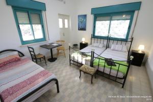 Auberg-Inn Guesthouse客房内的一张或多张床位