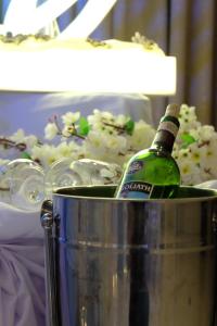 a bottle of wine sitting in a bucket at Hotel Estrella in Tacloban