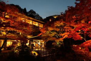 a building with a tree in front of it at Negiya Ryofukaku in Kobe