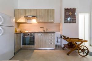 Kuchyň nebo kuchyňský kout v ubytování Apartments Gloria