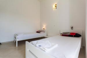 Postel nebo postele na pokoji v ubytování Apartments Gloria