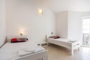 Postel nebo postele na pokoji v ubytování Apartments Gloria