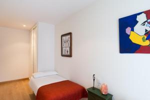 Posteľ alebo postele v izbe v ubytovaní San Roque Center - IB. Apartments