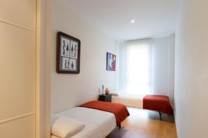 Posteľ alebo postele v izbe v ubytovaní San Roque Center - IB. Apartments