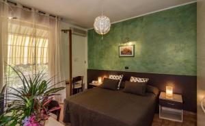 Postel nebo postele na pokoji v ubytování Hotel Gabrini