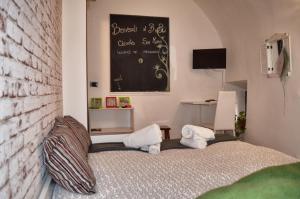 Кровать или кровати в номере B&B Chiostro San Marco