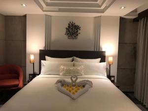 Postel nebo postele na pokoji v ubytování Anshel Hotel Seminyak + 37 fotografií