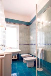 a bathroom with a sink and a toilet and a shower at Villa Bellaria B&B in Alseno +24 photos