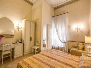 Voodi või voodid majutusasutuse Hotel Labelle toas
