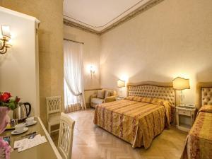 Voodi või voodid majutusasutuse Hotel Labelle toas