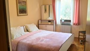 Postel nebo postele na pokoji v ubytování Apartment Maras