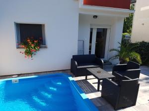 The swimming pool at or close to Happy Home Apartman