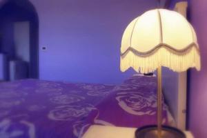 A bed or beds in a room at B&B Le Colline Country House