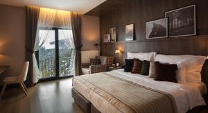 A bed or beds in a room at Jura Hotels Ilgaz Mountain Resort
