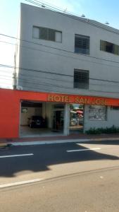 a hotelasy san hose sign on the side of a building at Hotel & Hostel San José in Ribeirão Preto
