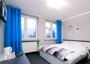 Postel nebo postele na pokoji v ubytování Pokoje Beskid Brenna
