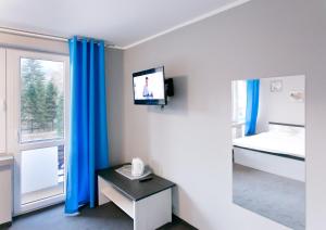 TV a/nebo společenská místnost v ubytování Pokoje Beskid Brenna