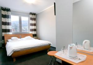 Postel nebo postele na pokoji v ubytování Pokoje Beskid Brenna