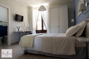 Postel nebo postele na pokoji v ubytování ReginElena B&B