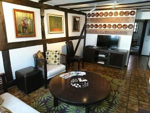 a living room with a table and a tv at Rütsche 10 in Limburg an der Lahn
