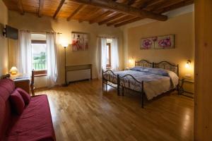 Postel nebo postele na pokoji v ubytování Hotel Alla Corte dei Bicchi