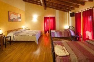 Postel nebo postele na pokoji v ubytování Hotel Alla Corte dei Bicchi