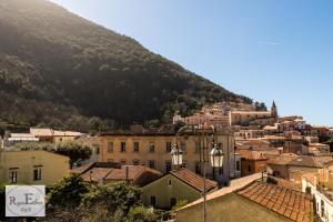 a view of a town with a mountain in the background at ReginElena B&B in Maratea