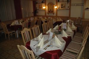 a large dining room with tables and chairs at Gasthof Platzschmied in Guttaring