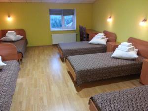 Postel nebo postele na pokoji v ubytování Hotel Nova
