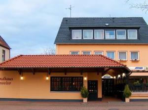 a large building with a red tile roof at Landhaus Havelse in Garbsen