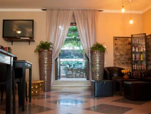 TV a/nebo společenská místnost v ubytování Boutique Hotel Corte Malaspina